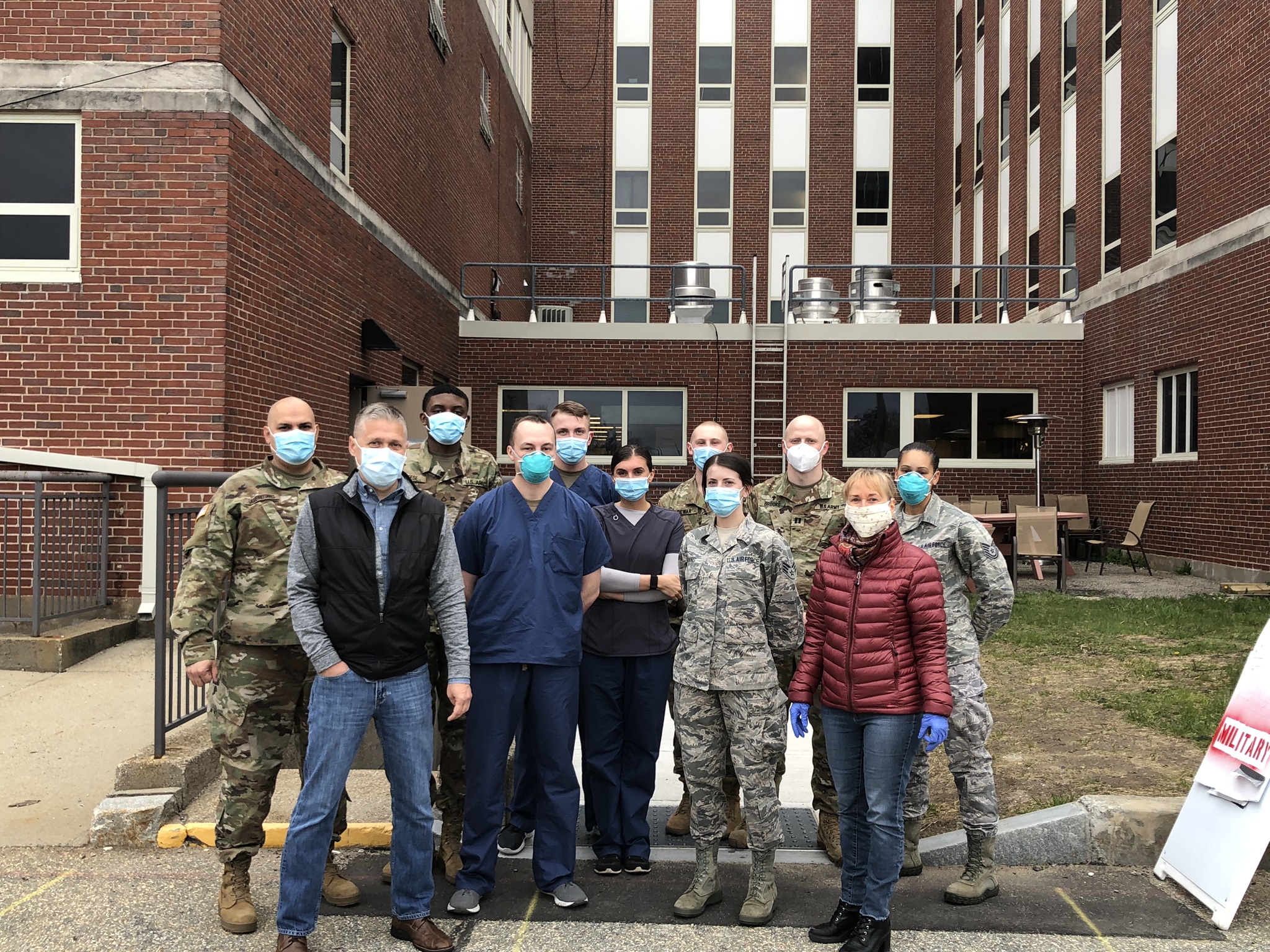 Group of military members, first responders and medical workers outside of a building, Pioneer Valley Financial Group, PV Financial Group charitable work, Pioneer Valley Financial Group and Mill's Tavern